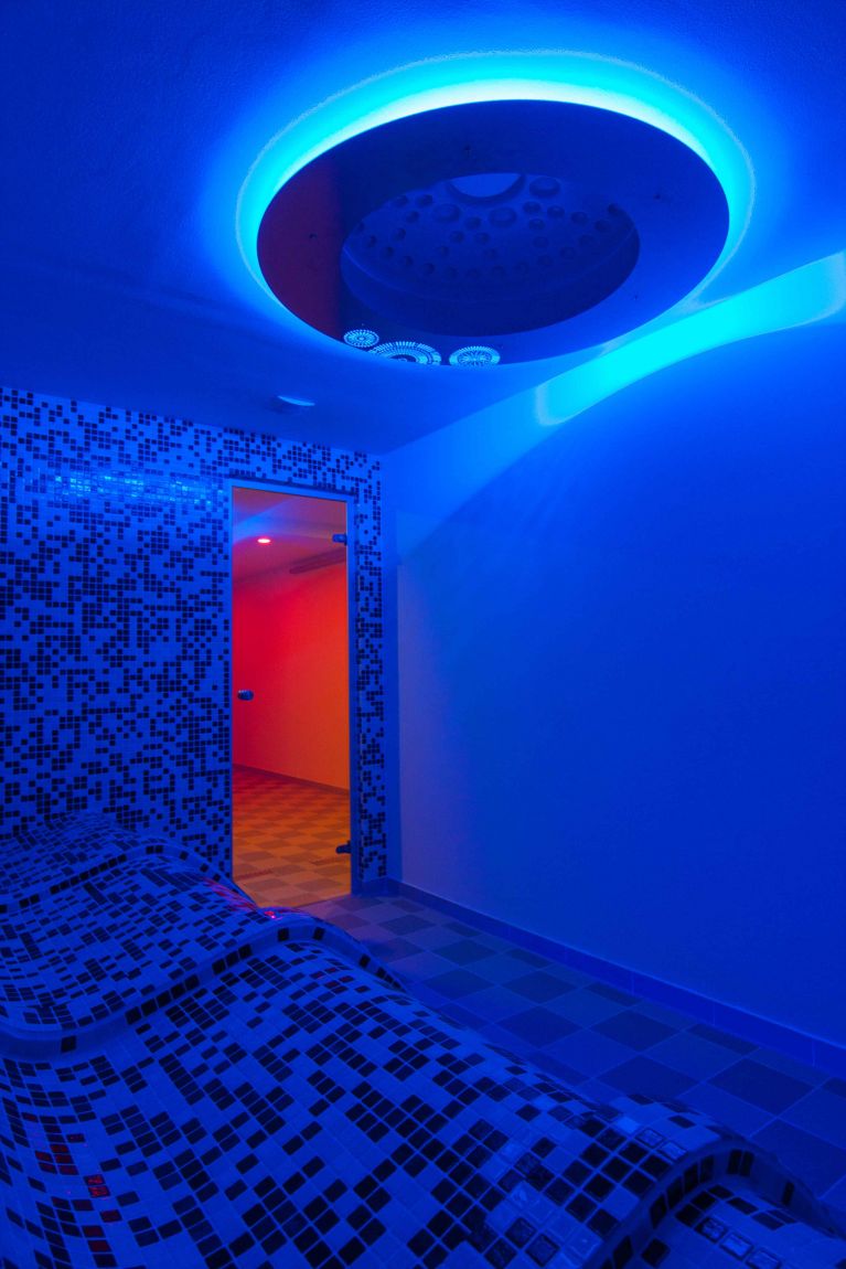 Loungers made of Profipref system and chromotherapeutic ceiling element Aura CARETTA SPA